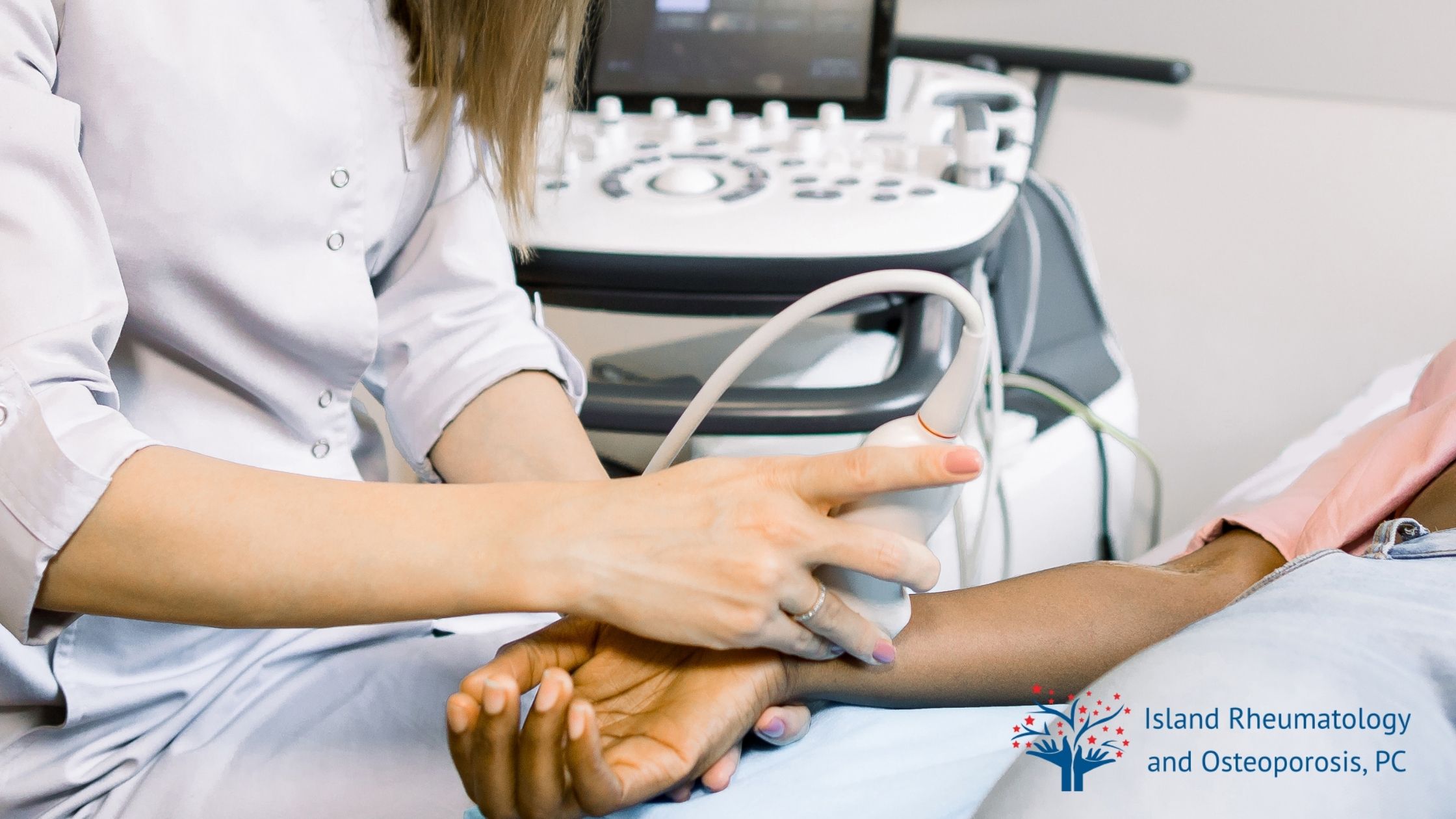 A healthcare professional performs an ultrasound scan on a patient's wrist, with medical equipment in the background and a clinic logo in the corner.